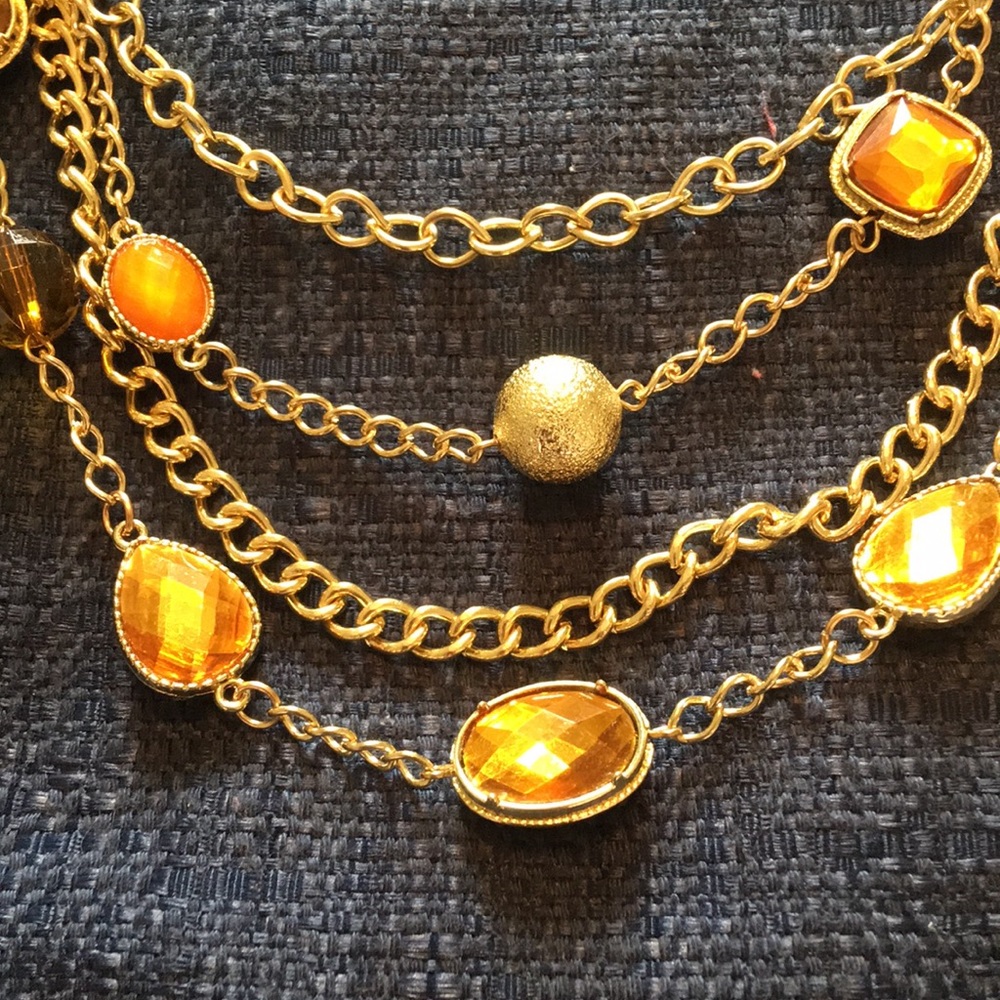 Gold necklace with amber colored jewels